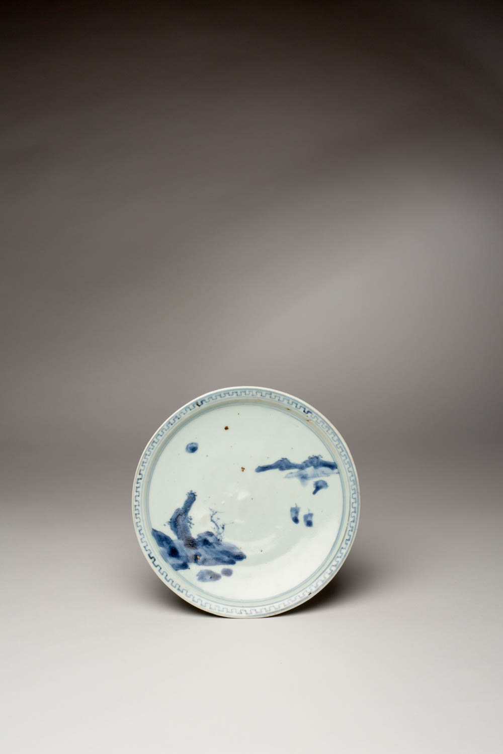 A RARE JAPANESE SHOKI IMARI DISH EDO PERIOD, C.1640-50 With an everted rim, the well decorated in