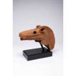 A JAPANESE HANIWA MODEL OF A HORSE'S HEAD KOFUN PERIOD, 7TH CENTURY Modelled in typical reddish