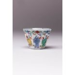 A RARE CHINESE OCTAGONAL WUCAI 'EIGHT IMMORTALS' CUP QING DYNASTY The exterior painted with the