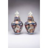 A PAIR OF LARGE JAPANESE IMARI VASES AND COVERS EDO PERIOD, C.1700 The baluster bodies decorated