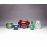 FIVE CHINESE MONOCHROME ITEMS QING DYNASTY Comprising: a red glazed tripod incense burner, two-