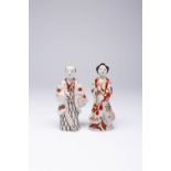 TWO SMALL JAPANESE IMARI FIGURES EDO PERIOD, C.1700 Both depicted standing with one hand raised to