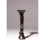 A JAPANESE BRONZE TRUMPET VASE MEIJI ERA, 19TH CENTURY The tall body with a flared neck and