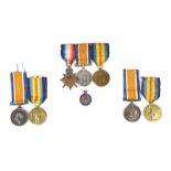 A small collection of First World War campaign medals, comprising: a 1914-15 Star trio to Bombardier