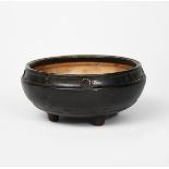 A Martin Brothers stoneware bowl on four feet by Edwin and Walter Martin, dated 1911, on four