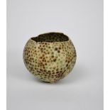 Mary Rogers (born 1929) a porcelain ovoid vase, on three small feet, irregular, split top rim,