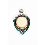 A rare Liberty & Co silver and enamel pendant locket designed by Archibald Knox, shield shape,