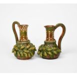 A near pair of Rye Pottery jugs, ovoid with cylindrical neck and flaring rim,applied with cob nut