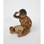 A Martin Brothers stoneware Imp Musician by Robert Wallace Martin, modelled seated playing a drum,