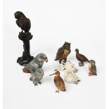 A cold painted bronze model of an owl, modelled standing, two cold painted bronze models of Grey