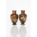 A pair of Martin Brothers stoneware vases by Robert Wallace Martin, baluster from, incised with