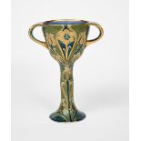 A James Macintyre & Co Green and Gold Florian Ware twin-handled chalice designed by William