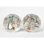 A pair of Fornasetti Oggetti Caccia plates designed by Piero Fornasetti, printed in colours with a