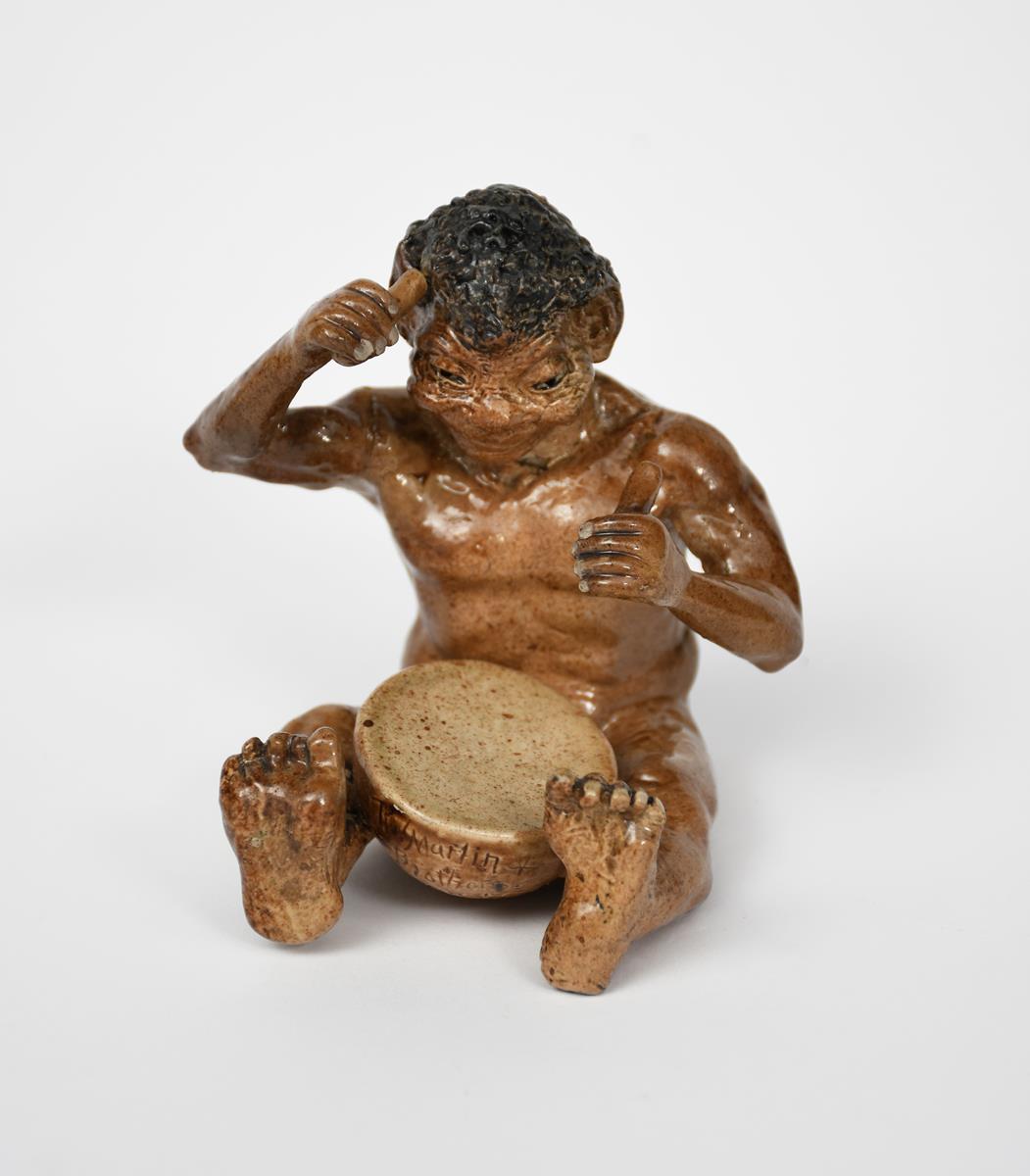 A Martin Brothers stoneware Imp Musician by Robert Wallace Martin, modelled seated playing a drum, - Image 2 of 2