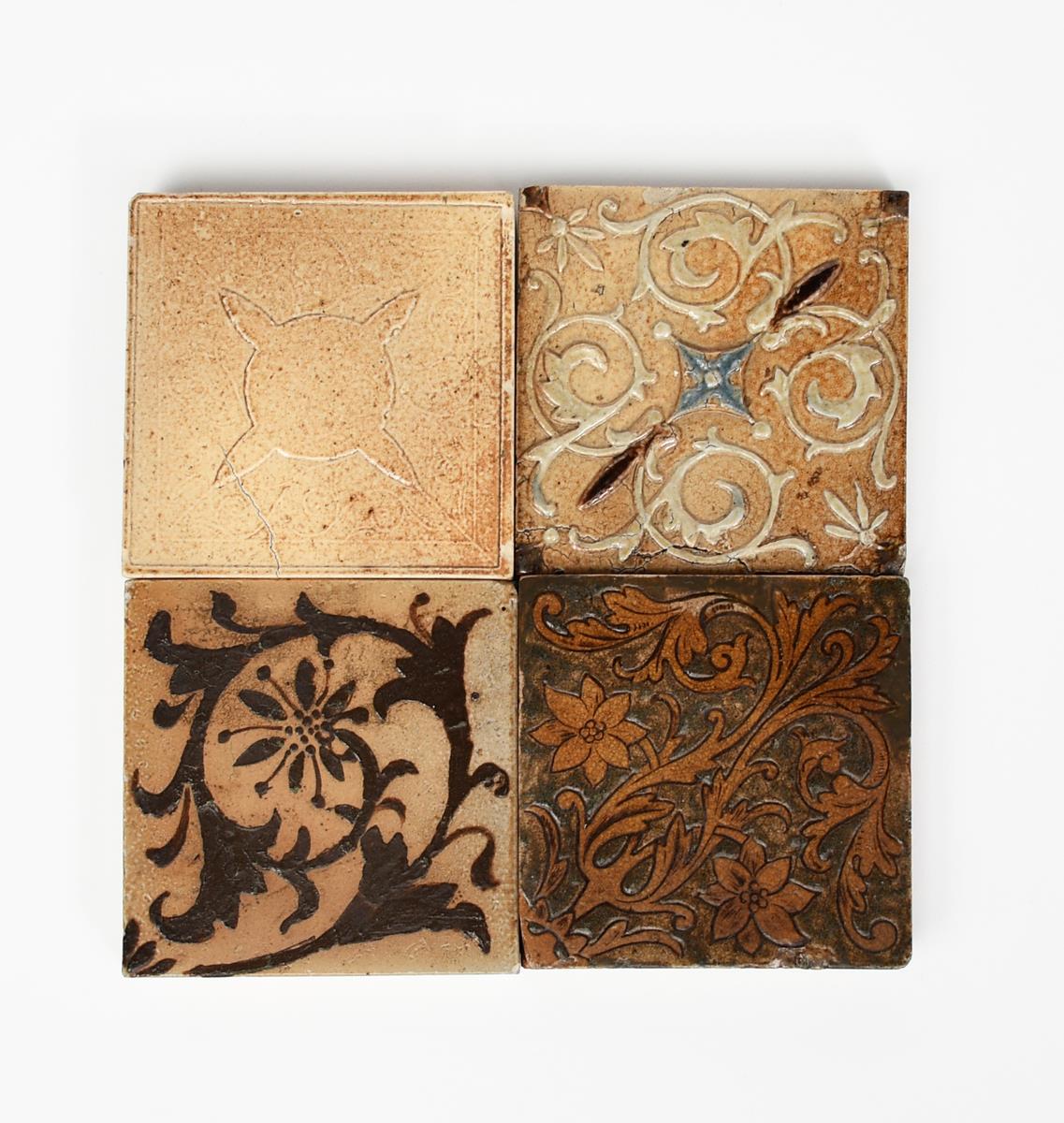 A Martin Brothers stoneware tile, square, incised with flowers and foliage, glazed in shades of