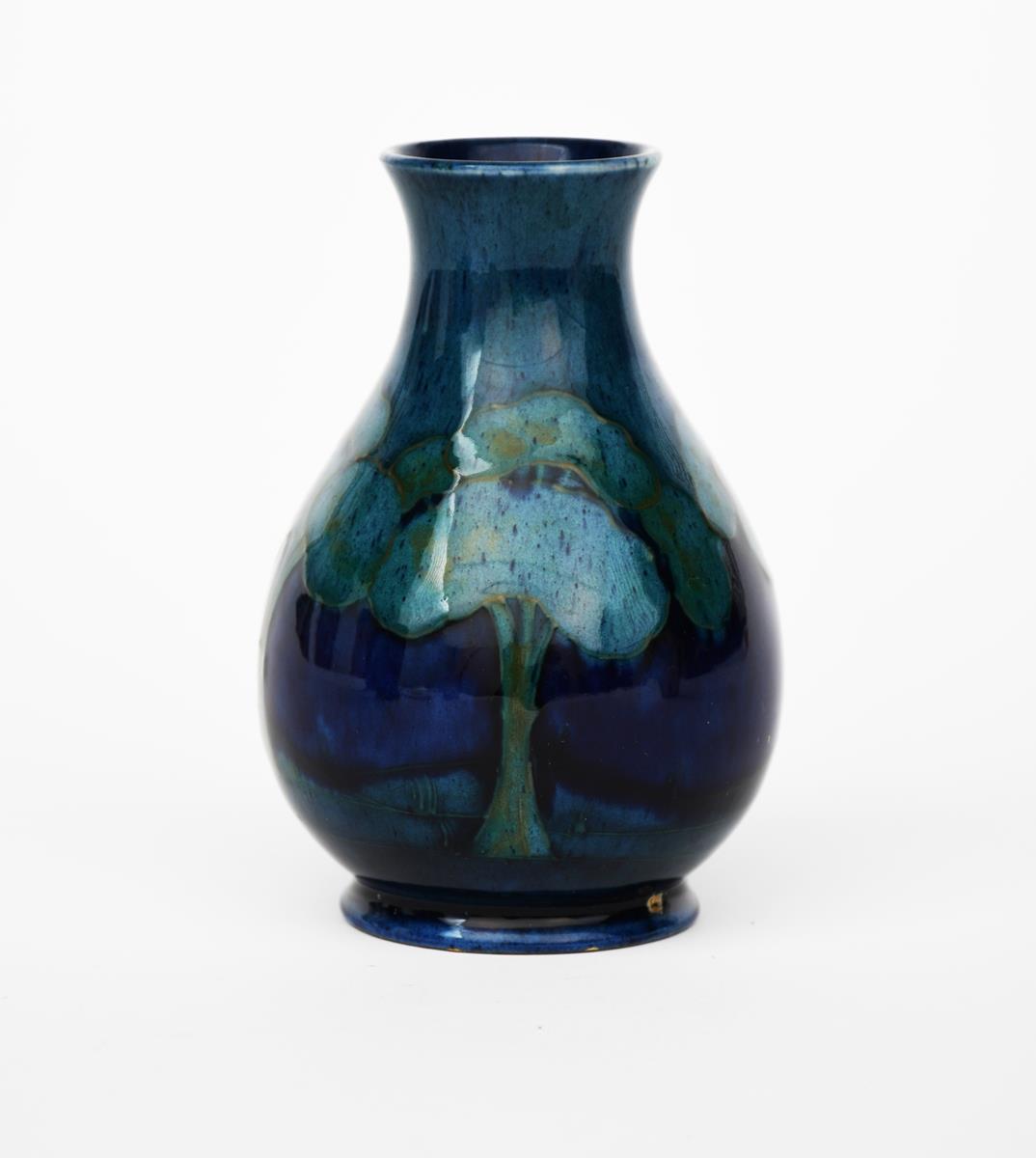 'Moonlit Blue' a Moorcroft Pottery vase designed by William Moorcroft, painted in shades of blue and