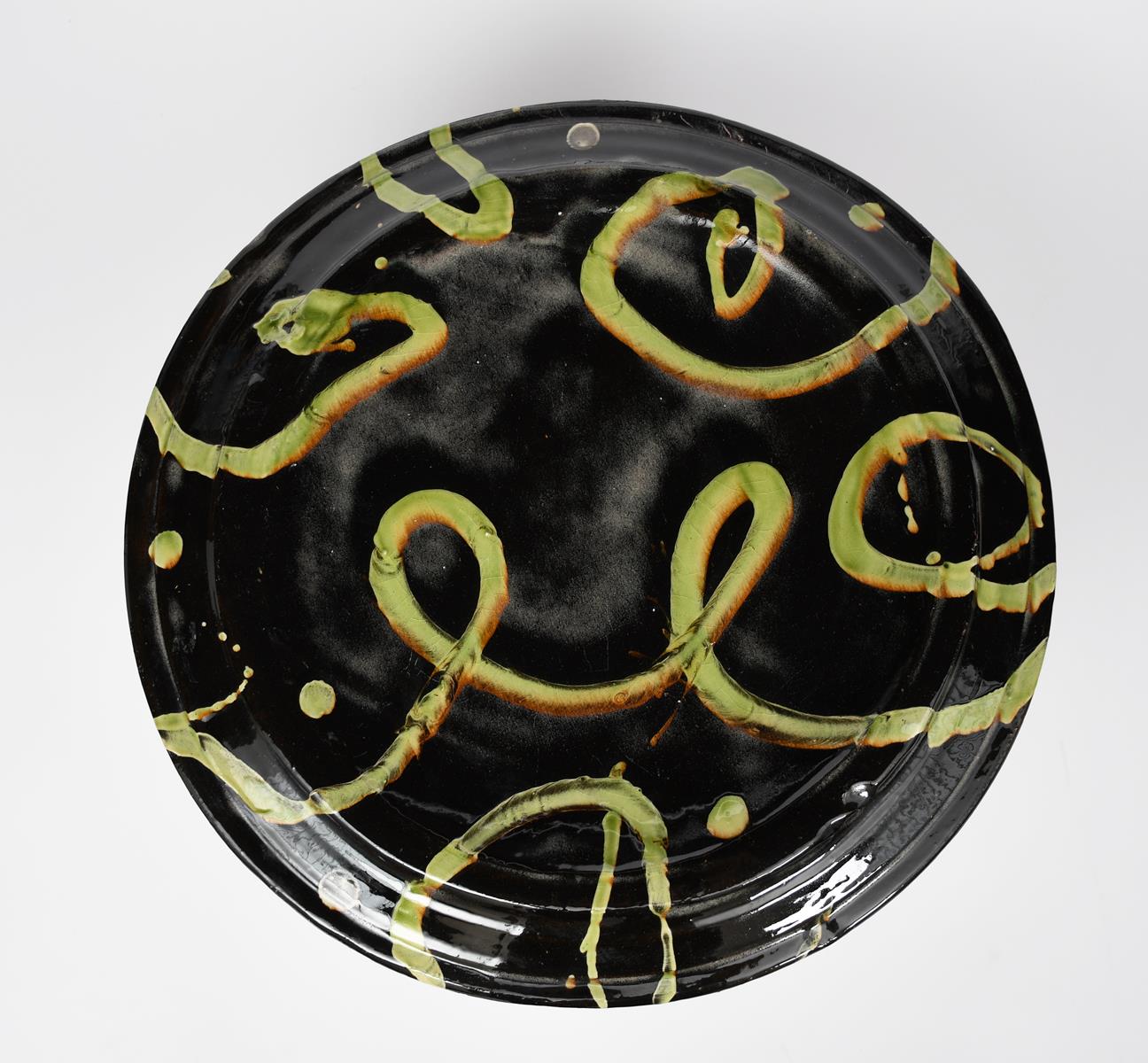 Dylan Bowen (born 1967) a large earthenware wall plaque, circular with raised rim, slip decorated in