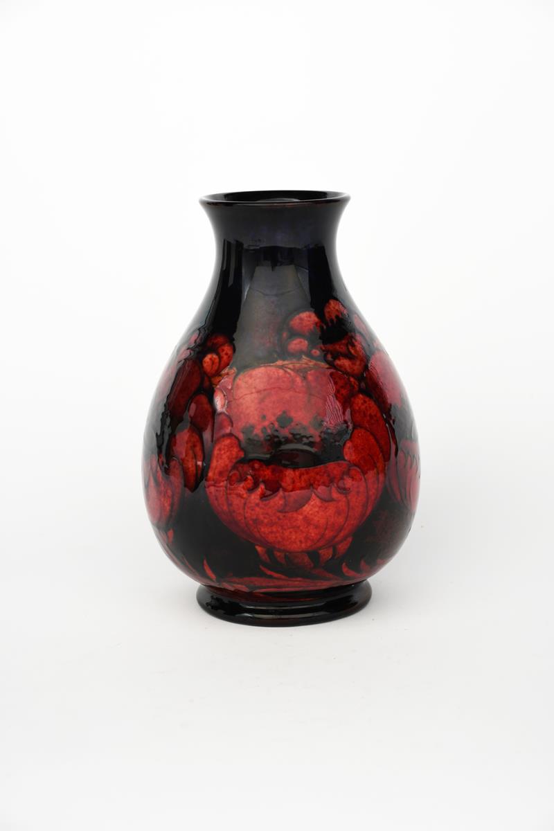 'Flambe Big Poppy' a Moorcroft Pottery vase designed by William Moorcroft, pear shaped, painted in