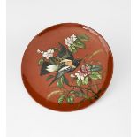 An Aesthetic Movement Mintons wall charger, painted with a bird flying past a bough of blossom,