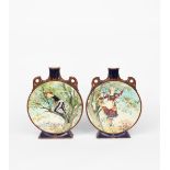 A pair of Minton Pottery moonflasks, flat disc form on flaring rectangular foot, with flaring