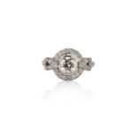 A diamond ring, collet-set with a brilliant-cut diamond weighing 0.75 carats, within an open work