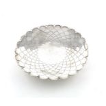 A silver dish, by Mappin & Webb Ltd, Sheffield 1932, of scalloped circular form, fish scale