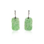 A pair of jadeite and diamond earrings, each designed as a pierced jadeite plaque carved with a