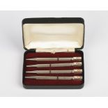 A set of four silver and enamel bridge pencils, marked sterling silver, engine-turned decoration,