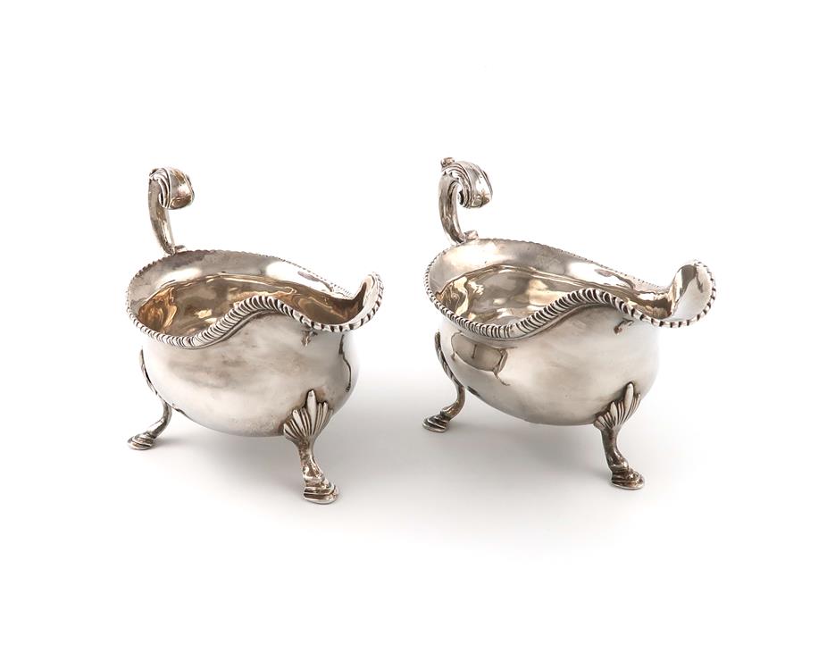 A pair of George III silver sauce boats, maker's mark partially worn, W?, London 1762, oval form,