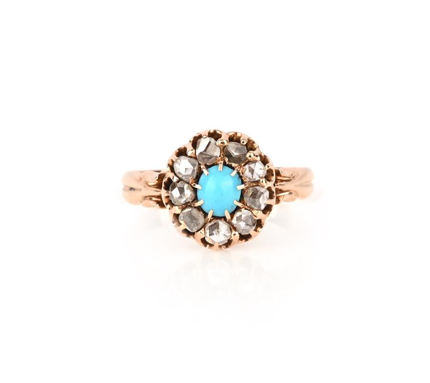 A turquoise and diamond cluster ring, the oval turquoise cabochon set within a border of rose-cut