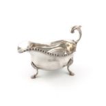 A modern silver sauce boat, by C. J. Vander, London 1965, oval form, gadroon border, leaf capped
