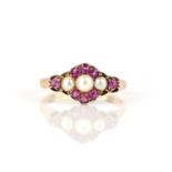 A Victorian ruby and pearl cluster ring, set with three untested pearls within border of rubies