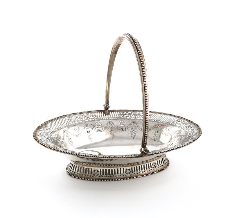 A George III silver swing-handled basket, by William Plummer, London 1782, oval form, pierced and