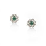 A pair of emerald and diamond earrings, each stud of cluster design, set with a circular-cut emerald