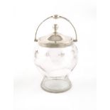 A silver mounted swing-handled cut glass biscuit jar, by William Huttons & Sons Ltd., Sheffield