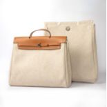 Hermes, a beige toile and naturel vache hunter 'Herbag 2-in-1', size MM, 2-in-1, with two