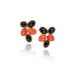 A pair of onyx and coral earrings, set with coral and onyx cabochons within textured gold border and