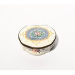 A Bilston enamel shaped snuff box c.1780, decorated with a blue linen ground panel enclosing flowers