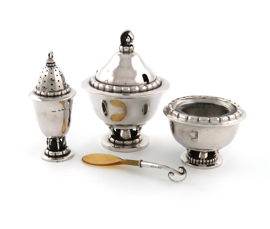 By Georg Jensen, a three-piece Danish silver cruet set, design no. 236, the pepper pot with import