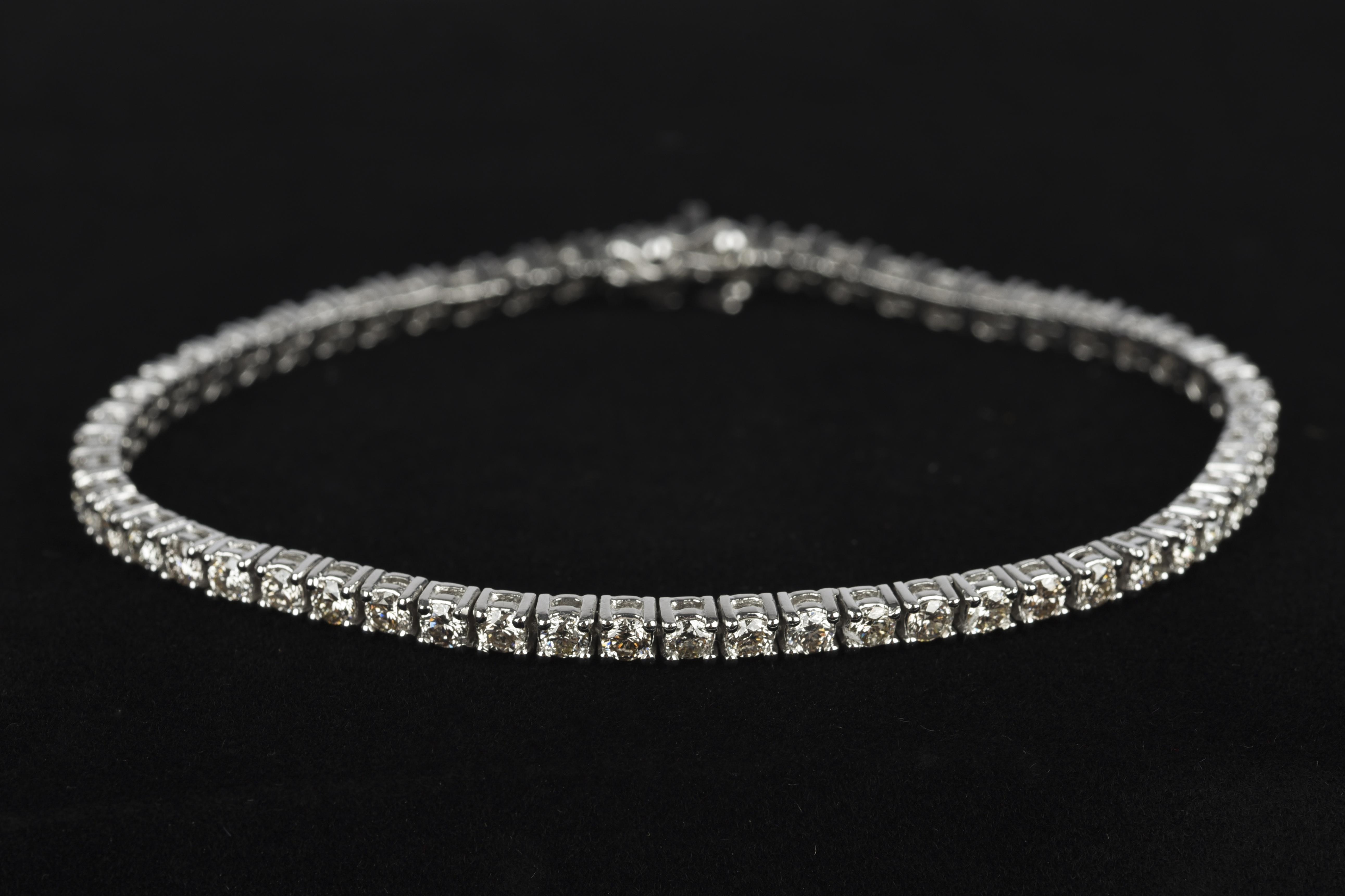 A diamond line bracelet, set with 56 round brilliant-cut diamonds weighing a total of 5.00 carats,