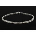 A diamond line bracelet, set with 56 round brilliant-cut diamonds weighing a total of 5.00 carats,