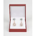 A pair of aquamarine, morganite and diamond drop earrings, the oval aquamarines within a surround of