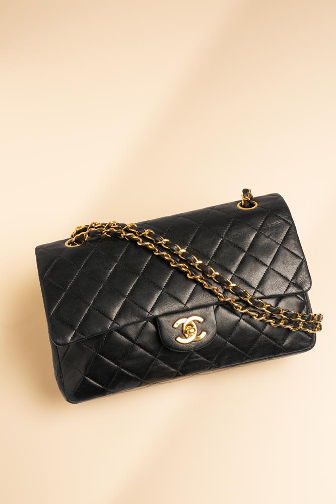 Chanel, a quilted black medium double flap bag, the black leather with gold tone hardware, with