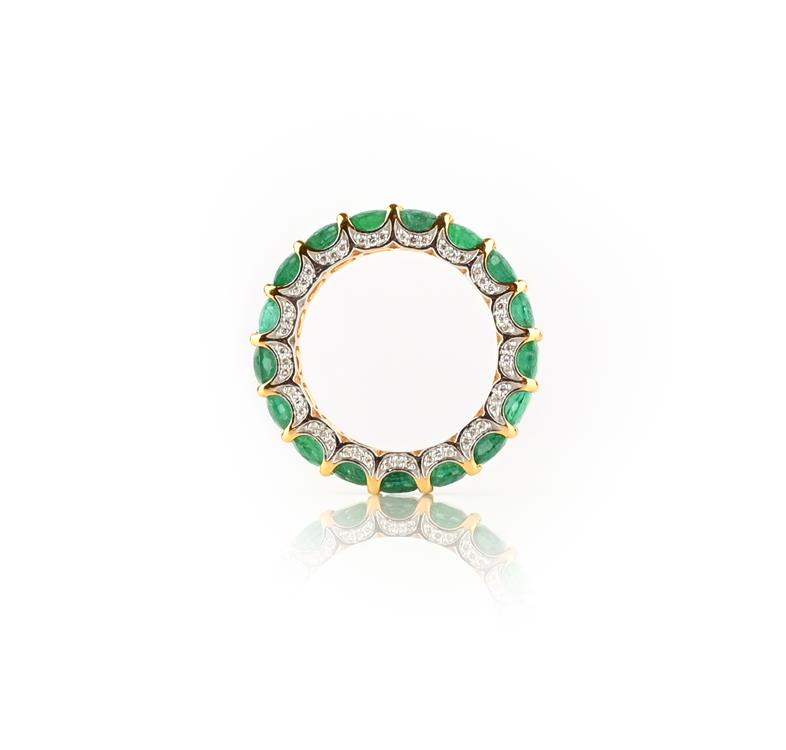 An emerald eternity ring, the full eternity set with oval emeralds weighing a combined total of 2.93