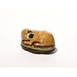 A rare English enamel dog bonbonniere c.1770, formed as a recumbent pug or mastiff, its head