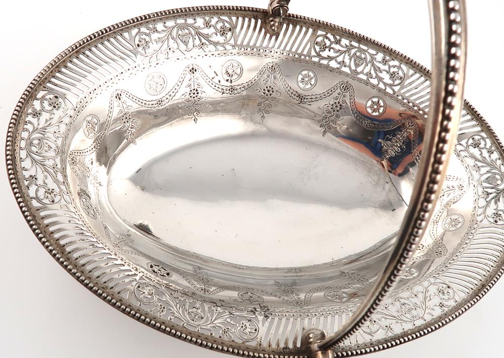 A George III silver swing-handled basket, by William Plummer, London 1782, oval form, pierced and - Image 2 of 10