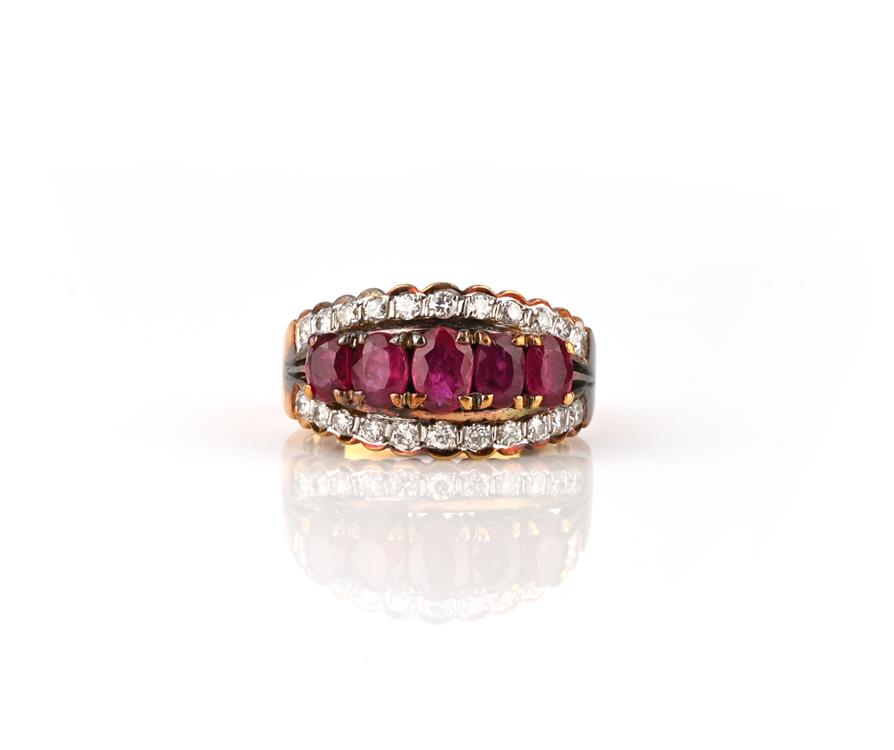 A ruby and diamond half hoop ring, set with five graduated oval-shaped rubies within a border of