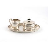 A Continental silver covered sugar bowl, cream jug and tray, possibly Norwegian, with a Dutch import
