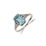 A zircon and diamond ring, mid 20th century, claw-set with a step-cut blue zircon, to shoulders