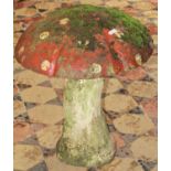 A novelty reclaimed two sectional garden ornament in the form of a toadstool with partially painted